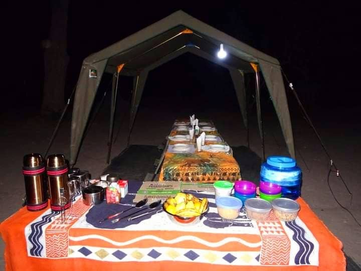 Camp chef preparing a meal outdoors in Botswana