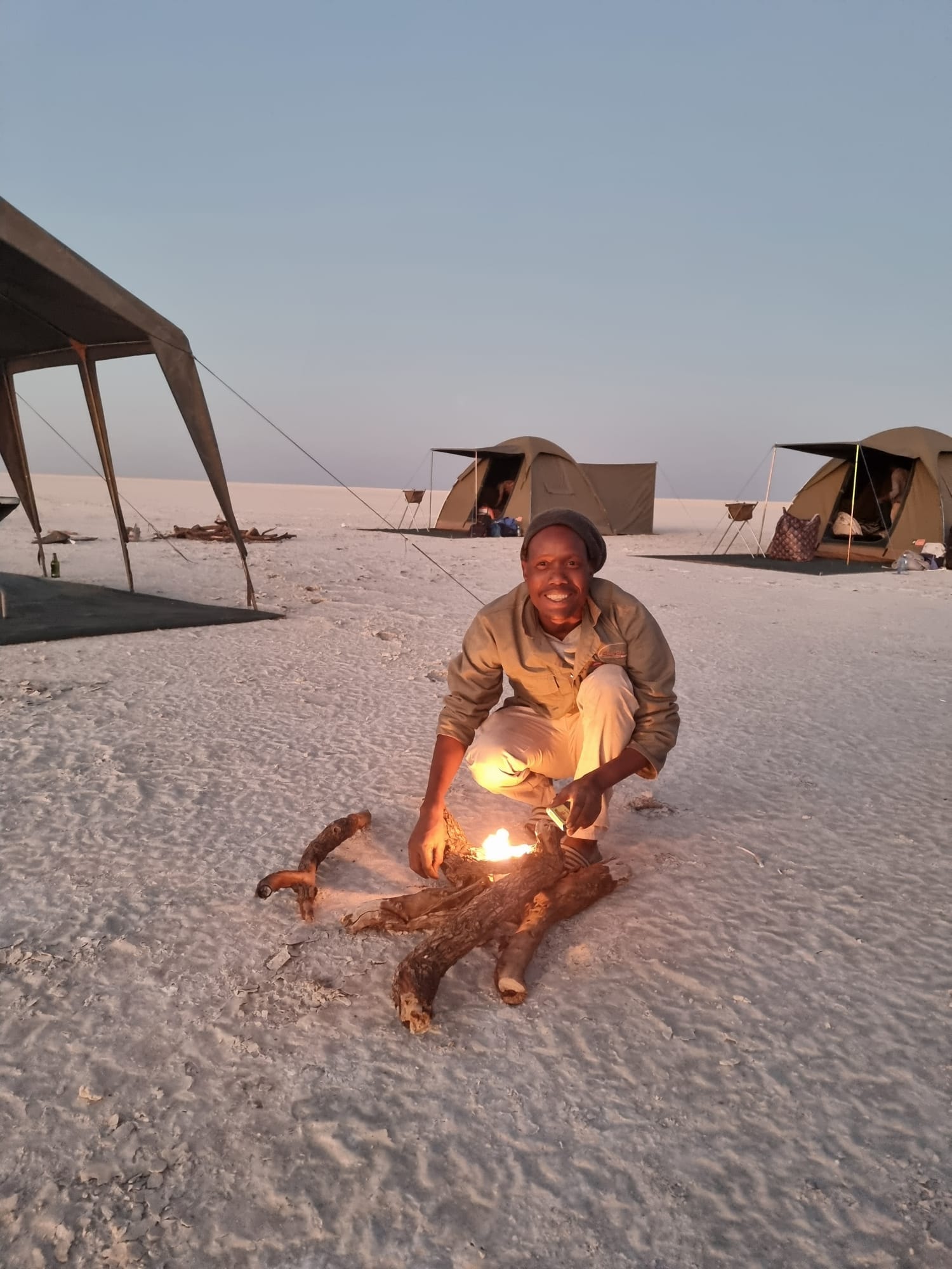 Canvas tent camp beneath acacia trees in Botswana