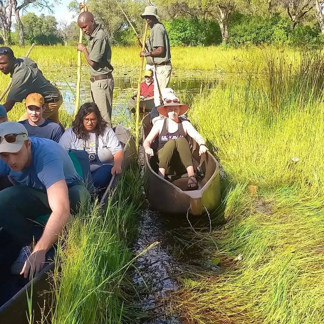 Guests on a guided mokoro excursion through the Okavango Delta